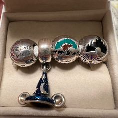 Authentic Pandora Disney Parks Exclusive Charms. Includes Magic Kingdom, Animal Kingdom, Walt Disney World, And Mickey’s Sorcerer Hat. Comes In Disney Parks Pandora Box. Sorcerer Hat, Pandora Disney, Pandora Silver, Magic Kingdom, Pandora Jewelry, Disney Parks, Walt Disney World, Animal Kingdom, Disney World