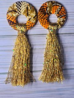 Yarn Tassel Earrings – Royal Creations by Acacia Bohemian Orange Tassel Earrings For Party, Gold Bohemian Tassel Earrings For Spring, Adjustable Tassel Earrings For Spring Party, Festive Multicolor Tassel Earrings, Orange Beaded Tassel Earrings As Gift, Multicolor Fringe Earrings For Party, Multicolor Fringe Party Earrings, Fringe Earrings For Spring Party, Festive Bohemian Beaded Tassel Earrings