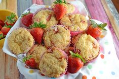 strawberry muffins on a plate with strawberries