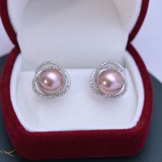 11-12mm Freshwater Pearl Earrings Treat yourself to timeless elegance with these 11-12mm Freshwater Pearl & Rose Floral Earrings from House of Pearls. Classically crafted from freshwater pearls, these earrings exude a classic charm that never goes out of style. The soft, rosy hue of the pearls gives them an added sense of allure, while the simple design keeps them versatile enough to wear it with almost any outfit. Perfect for casual or formal occasions, these timeless studs will add a hint of l Rose Gold Akoya Pearl Earrings For Gift, Rose Gold Sterling Silver Round Pearl Earrings, Elegant Rose Gold Akoya Pearl Earrings, Rose Gold Pearl Earrings For Anniversary, Rose Gold Pearl Round Earrings, Rose Gold Pearl Charm Earrings, Rose Gold Round Pearl Charm Earrings, Elegant Pink Sterling Silver Bridal Earrings, Elegant Pink Pearl Earrings In Sterling Silver