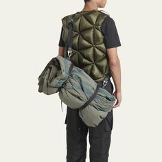 a man with a backpack and sleeping bag