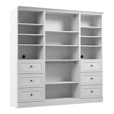 an empty white bookcase with drawers on it