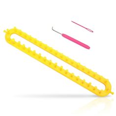 two yellow plastic combs are next to each other on a white surface, one is holding a pink toothbrush and the other has a pair of scissors