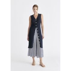 This dress, crafted from a cosy cotton mix, features intricate pointelle knit detailing for a touch of elegance. Wear it as a standalone dress for a chic look, or unbutton it and layer over trousers for a fashion-forward ensemble. The adaptability of this dress makes it a go-to piece for both casual and elevated occasions, ensuring you effortlessly embody modern sophistication and comfort.  V scallop neckline and hem, button blacket. Perfect for: Work and weekends. COMPOSITION: 85% Cotton 15% Ny Casual Crochet Dress With Pointelle Knit And V-neck, Chic Textured Knit Summer Dresses, Elegant Pointelle Knit Midi Dress For Summer, Spring Ribbed Dress For Layering, Elegant Knit Midi Dress For Day Out, Elegant Midi-length Crochet Dress With Pointelle Knit, Spring Midi Dress In Pointelle Knit, Summer Knit Dress For Loungewear, Summer Knit Loungewear Dress