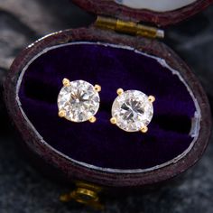 These traditional diamond stud earrings are each accented with one (1) round brilliant cut diamond set into a four-prong setting. The 14k yellow gold earrings are finished with posts and friction backs for pierced ears. Yellow Gold Single Cut Diamond Earrings For Anniversary, Classic Yellow Gold Diamond Earrings For Formal Occasions, Timeless Yellow Gold Diamond Earrings For Formal Occasions, Formal Yellow Gold Diamond Earrings, Formal Yellow Gold Brilliant Cut Earrings, Classic Gold Earrings With Single Cut Diamonds, Luxury Yellow Gold Diamond Earrings With Vvs Clarity, 14k Gold Brilliant Cut Earrings For Formal Occasions, Formal 14k Gold Brilliant Cut Earrings