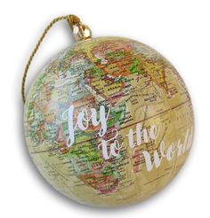 a globe ornament with the words joy to the world on it's side