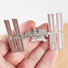 The most accurate International Space Station Enamel Pin on Etsy! As true to the original ISS as we could make it. This hard enamel pin makes the perfect gift for your resident astronaut, scientist, astronomer, rocket engineer, or space lover.  100 pins made.   1st Edition.  Year: 2021 Silver plated brass pin. 3 inches Comes individually packaged with two silver butterfly clasps. Space Scientist, Nasa Gifts, Lapel Brooch, Nasa Space, Space Gift, Brass Pin, International Space Station, Space Station, Hard Enamel Pin