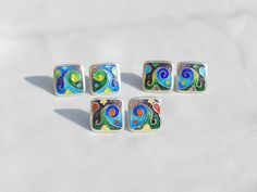 The advantages of the cloisonne enamel earrings: 🔷 it is lightweight 🔷 100 % handmade 🔷 is unique, one of a kind 🔷 reasonable size and weight allows you to wear every day 🔷 matches with different types of outfits - dresses and pants as well 🔷 May be a perfect gift for people who love handmade gifts ... This artwork earrings are 100 % handmade by me in my studio. The technique is called Cloisonne enamel which is well known in Georgia. Cloissone is using tiny metal strips to make a pattern then putting powder enamel into the spaces to make a design. Then it is heated in a kiln until the powder becomes glass. Cloisonne enamel is such a delicate art form... Many people in my country love buying handmade cloisonne enamel jewelry because they are unique and special!  DIMENSIONS: 0.5 X 0.5 Silver Enamel Pin For Gift, Artistic Enamel Jewelry For Formal Occasions, Artistic Multicolor Jewelry For Formal Occasions, Artistic Multicolor Jewelry For Formal Events, Artistic Multicolor Formal Jewelry, Elegant Enamel Earrings With Artistic Design, Unique Multicolor Enamel Pin Gift, Unique Multicolor Enamel Pin For Gift, Enamel Clip-on Earrings As Gift