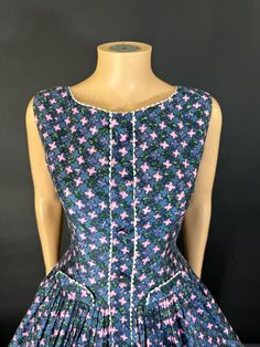 Such a cute little 1950s day dress in outstanding condition and in a wonderful polished cotton. The shape is really sweet that's dropped waste and lovely full skirt. It's absolutely adorable. it fastens the centre back zip has been washed and pressed.(petticoat not included) Bus 38 inches Waist 29 inches Waist to hem 23 inches +2 inch hem Cotton A-line Vintage Dress, Fitted Cotton Vintage Dress For Garden Party, Vintage Cotton Dress With Buttons, Cotton Vintage Dress With Buttons, 1950s Style Cotton Lined Dress, Cotton 1950s Style Lined Dresses, Retro Cotton Dress For Garden Party, 1950s Style Lined Dress For Garden Party, 1950s Lined Dress For Garden Party