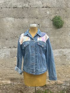 Womens denim jacket Levi's brand size small could fit a medium. Upcycled and repurposed with vintage quilt pieces Retro Patchwork Denim Jacket For Fall, Retro Denim Patchwork Outerwear, Spring Patchwork Denim Jacket In Medium Wash, Medium Wash Fitted Patchwork Outerwear, Fitted Medium Wash Outerwear With Patchwork, Fitted Medium Wash Patchwork Outerwear, Fall Patchwork Recycled Denim Jacket, Vintage Denim Patchwork Outerwear, Retro Cotton Denim Jacket With Patchwork