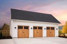 a three car garage with two doors on each side