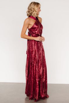 This eye catching dress is designed to make you dazzle at any occasion All burgundy color Sequins throughout tulle material Criss cross gathered halter neckline Pleated tank sleeves Open back style with zipper Criss cross straps with tie detail at back Fitted bodice with flowing maxi skirt Fully lined Self and Lining: 100% Polyester Contrast: 97% Polyester, 3% Spandex Trina is 5'6, cup size 32D, size 2 and is wearing size S Glamorous Tie Back Halter Dress For Prom, Glamorous Tie-back Halter Dress For Prom, Cocktail Jumpsuit, Tulle Material, Destination Dress, Sequin Maxi Dress, Sequin Maxi, Romper Outfit, Velvet Fashion