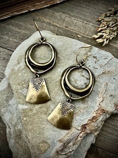 "Antiqued bronze with raw brass ear wires.  3\" L x 1.25\" W These are thick metal, not lightweight and will tug on your earlobes. ▲ To see more, click here to return to my shop: https://www.etsy.com/shop/AspenGlowStudio ▲ Don't forget to favorite my shop for updates Many of my designs have natural stones, these stones will slightly vary from one another so remember that yours may not be exactly like the ones pictured but they will be VERY similar.  Please be careful with your jewelry, they have Pendulum Earrings, Antique Gold Earrings, Copper Uses, Earrings Bohemian, Brass Jewelry, Raw Brass, Stainless Steel Jewelry, Bronze Color, Ear Wires