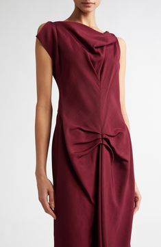 A fall '24 runway highlight, this asymmetric midi dress reimagines a signature house style with an elegant drape at the neckline and pleat detailing at the waist for effortless sophistication. 50" length (size 2) Hidden back zip; keyhole with hook-and-eye closure Asymmetric neck Single cap sleeve Unlined 100% viscose Dry clean Made in Portugal Designer Clothing Fall 24, Elegant Drapes, Victoria Dress, Fabric Gifts, Free Fabric, Nordstrom Dresses, Victoria Beckham, Cap Sleeve, Clothing Items