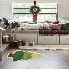 a living room filled with lots of furniture and christmas decorations on top of windowsills