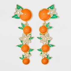 Elevate your style with the SUGARFIX by BaubleBar Citrust Me Earrings. These playful and vibrant accessories capture the essence of juicy citrus fruits with their realistic orange design. Crafted with meticulous attention to detail, these earrings bring a pop of color and a touch of whimsy to any outfit. Perfect for adding a fun and fruity twist to your look, the Citrust Me Earrings are a delightful choice for those who love to make a bold and fresh fashion statement. Summer Orange Jewelry With Fruit Design, Martini Outfit, Vibrant Accessories, Convention Outfits, Resort Jewelry, Orange Accessories, Baublebar Earrings, Fresh Fashion, Baublebar Jewelry