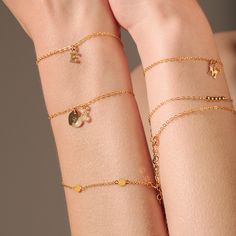 *Initial price displayed exclusive of charm* Get this cute and dainty initials bracelet for yourself or a thoughtful gift for your love ones. Add up to 3 initials to this bracelet to make it uniquely yours. Step 1: Pick the number of Initials you want Step 2: Select your initials from the dropdown box Material 14 Karat Gold Filled. Nickel free. Suitable for sensitive skin. Quantity & Measurement Alphabet A~Z Adjustable length: 6.3 + 1 inches extension Letter size: 5mm height, 0.5mm thickness Personalized Heart Bracelet, Initials Bracelet, Gold Bar Bracelet, Disc Bracelet, Alphabet A, Bead Bar, Bar Bracelet, Letter Bracelet, For Your Love