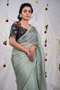 Ice green saree with embroidered border, elevated with placement embroidered buttis using resham, cutdana beads. Comes along with an unstitched blouse piece. - Aza Fashions Designer Green Pre-draped Saree With Embroidered Border, Green Resham Embroidered Cotton Silk Blouse Piece, Pre-draped Embroidered Saree, Pista Green Embroidered Blouse Piece For Festivals, Festival Blouse Piece In Pista Green With Embroidered Border, Green Blouse Piece With Resham Embroidery For Transitional Seasons, Fitted Tissue Silk Saree With Embroidered Border, Transitional Green Blouse Piece With Resham Embroidery, Festive Green Pre-draped Saree With Embroidered Border