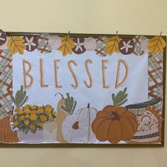 a sign that says, blessed with pumpkins and gourds in the background