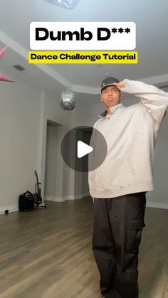 a man standing on top of a hard wood floor next to a dance class sign