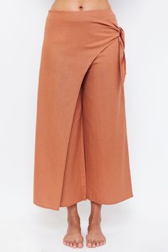 Exude vacation vibes. The pair of trousers that combines premium, style, and modesty. So you never compromise on form or function on your next getaway. The culotte-style trousers you dream of while in the heat, provide complete coverage and flattering waist detailing to keep you cool and covered. Wrap yourself in the mix semi-skirt wrap for a distinctive take on a classic cut. 100% premium cotton for durability and cool Flattering side-waist belt design Subtle side pockets for your grab and go h Cute Modest Swimwear, Beach Trousers, Hijab Collection, Beachwear Collection, Modest Swimsuits, Vacation Vibes, Modest Swimwear, Belt Design, Layer Dress