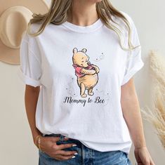 Mommy To Bee Shirt, Pregnancy Reveal Shirt,mommy to bee, Pooh Bear shirts, Winnie The Pooh Tee, mommy to be shirt, Baby Shower Shirt, magic Thank you so much for taking the time to browse my shop. All of our items are just for you. Please feel free to reach out if you have any questions before or after purchasing.   We provides the highest quality fabrics and materials. Non-toxic vinyl is used in the design of the shirts. Our vinyl has been certified by "REACH", "Oeko-Tex® Standard 100 Class I". Mommy To Be Shirts Ideas, Baby Shower Shirt, Baby Shower Shirts, Bee Shirt, Pregnancy Reveal Shirt, Mommy To Bee, Baby Gender Reveal Party, Mommy To Be, Mommy Shirts