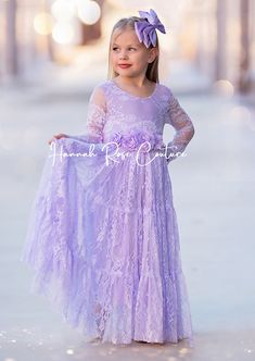 Make dreams come true with our Exquisite Lilacs in Spring Flower Girl Dress, a must-have for any elegant, bohemian or traditional wedding theme. This dress is all lace and showcases a whimsical lace bodice, adorned with intricate details and a graceful, feathered V-back. The skirt boasts a breathtaking 3 section design also in lace, adding a touch of elegance to every step. Whether she's guiding the bride down the aisle or twirling on the dance floor, your flower girl will radiate pure charm and Traditional Wedding Theme, Romantic Disney, Lavender Flower Girl Dress, Lilac Flower Girl Dresses, Burgundy Flower Girl Dress, Section Design, Purple Flower Girl Dress, Theme Soft, Lace Flower Girl Dress