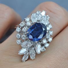 Certified 6.30CT (E-F / VS2-SI1) Oval, Round, and Marquise Cut Diamond and Blue Sapphire Engagement Ring in 18KT White GoldCenter: 1 oval cut blue sapphire weighing 3.50 caratSide Stones 1: 16 round cut diamonds weighing 1.00 caratSide Stones 2: 10 marquise cut diamonds weighing 1.80 caratGet inspired with our 6.30 ct diamonds and blue sapphire - engagement ring MDL#PSRI1177. This engagement ring is designed with 2.80 carat side diamonds. At Primestyle.com, we deal ONLY with 100% real, natural a Expensive Sapphire Engagement Ring, Luxury Sapphire Diamond Ring, Luxury Blue Marquise Cut Sapphire Ring, Luxury Engagement Ring, Luxury Stuff, Fancy Sapphire, Luxury Engagement Rings, Blue Sapphire Engagement Ring, Jewellery Design Sketches