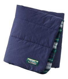 an image of a blue quilted pillow on a white background with the label l l bean