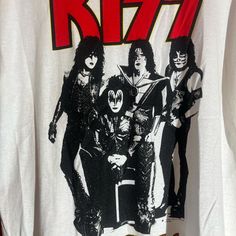 Band: kiss Size:  20" pit to pit  &      26" collar to bottom  Colors: white Condition: good, stain on back shown in picture  **all of our shirts are PRE-OWNED and may contain normal wear, fading, stains or imperfections, holes, tears, loose or missing threads. We will do our best to point out significant issues. Thank you for looking!! #tshirt #fashion #streetwear #tshirts #graphic Streetwear Tshirts, Band Kiss, Kiss Band, Tshirt Fashion, Mens T Shirts, Fashion Streetwear, Baby Tee, Infant Tees, Size 20