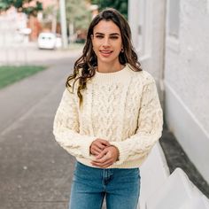 The Women's Beige Cable Knit Drop Shoulder Sweater is the cozy hug you never have to ask for. Perfectly oversized for lounging, it offers a relaxed fit that makes it ideal for chilly mornings and cozy evenings at home. The beautiful cable knit pattern adds a touch of texture and warmth, making it both stylish and functional. Whether you're snuggling up with a book or heading out for a casual coffee date, this sweater is versatile enough to transition seamlessly between lounging and outings. Pair Cozy Textured Knit Cropped Sweater With Relaxed Fit, Cream Soft Knit Cozy Sweater, Beige Cable Knit Sweater For Loungewear, Cozy Cable Knit Sweater In Relaxed Fit, Cream Cozy Fit Soft Knit Sweater, Cozy Fit Cream Knit Sweater, Cozy Cable Knit Cropped Sweater In Winter White, Cozy Soft Knit Cream Sweater, Cozy Textured Knit Cream Sweater