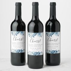 three bottles of wine sitting next to each other