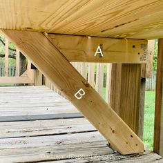 the bottom half of a wooden deck with measurements on it and an arrow pointing up