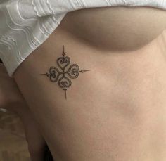 a woman with a tattoo on her stomach