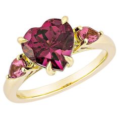 Sunita Nahata presents an elegant Rhodolite fancy ring in a heart shape, set with sparkling white diamonds. This exquisite piece exudes grace and elegance, making it perfect for both daily wear and special occasions. Crafted from 18-karat yellow gold, this ring is a timeless addition to any jewelry collection. Rhodolite and Pink Tourmaline Fancy Ring in 18Karat Yellow Gold. Rhodolite: 3.16 carat, 9X9mm size, heart shape. Rhodolite: 0.39 carat, 5X3mm size, pear shape. Gold: 4.41g, 18Karat Yellow Rainbow Gemstones, Fancy Rings, Tourmaline Pendant, Contemporary Pendant, Modern Ring, Yellow Gold Pendants, Yellow Gold Earring, White Diamonds, Diamond Stone