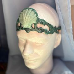 This beautiful circlet was created to match the Ailea Finbella tail by Finfolk Productions and Merbella studios . Aquarium safe, Stretchy, comfy, waterproof, and so cute! Now with black or tan bands available by request. Made from dragon skin silicone, water tested, and skin safe. Back Strap can be worn under or over hair. Be your own little mermaid! Tail not included. Merbella Mermaid Tails, Adjustable Green Headpiece For Festivals, Adjustable Green Festival Headband, Adjustable Green Headband For Festivals, Whimsical Adjustable Headband For Festivals, Adjustable Fantasy Headband For Costumes, Handmade Adjustable Headband For Costume, Bohemian Adjustable Costume Headpieces, Adjustable Green Bohemian Headpieces