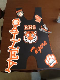 an orange and black tiger jersey on a table