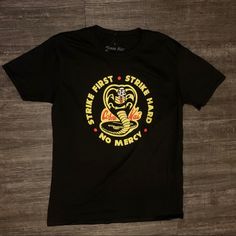 Cobra Kai Tshirt Brand New Comes With Tags Amzing Quality Size M And Large Available #Cobrakai #Retro #90s #80s #Vintage Black Retro T-shirt With Text Print, Vintage Black T-shirt With Front Print, Black Retro Shirt With Screen Print, Retro Black Shirt With Screen Print, Retro Black Top With Front Print, Retro Black T-shirt With Front Print, Retro Black Shirt With Graphic Print, Retro Black Shirt With Text Print, Retro Black Shirt With Front Print