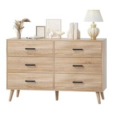 an image of a dresser with many things on it's top and bottom drawers