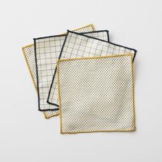 three napkins with different patterns on them