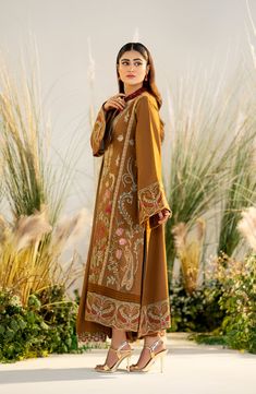 Brown Elegant Pakistani Salwar Kameez Dupatta Embroidered Suit is a lavish attire that gives you a charismatic appearance on the festive occasion. Luxury designs and embellishments make this stunning attire an epitome of beauty and your priority for the big day. Kameez: The kameez comes in an alluring plum shade and it has a premium quality khaddi net fabric. The neckline and sleeves of this beautiful kameez are adorned with embroidery and embellishments, making it a chic choice to wear at a tra Pakistani Boutique, Pakistani Salwar, Embroidered Suit, Winter 23, Pakistani Salwar Kameez, Luxury Wear, Leather Dye, Suit Fabric, Embroidery Fashion