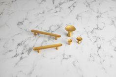 brass handles and knobs on a marble surface