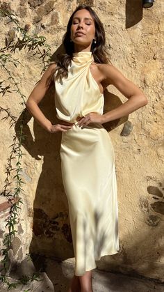 DETAILSOur Esther Maxi Dress is the epitome of high class. This elegant high neck drape detailing makes this maxi the perfect choice for elegant wedding festivities. Add a nude bag and heels for that simple finishing touch. - Maxi length- High neckline- Asymmetrical shoulder design- Invisible zipper and button closures on back- Elasticated waist- 100% PolyesterSeen styled here on the gorgeous mumma to be @valaree.ahern wearing a size 18MODELMEASUREMENTSFor additional information regarding product sizing. please contact our customer service team at customerservice@billyj.com.au x Approx garment measurements are in cms Please allow 1-2cm tolerance SIZE BUST WAIST HIPS LENGTH 6/XS 88 66 98 131 8/S 92 68 102 132 10/M 96 72 110 133 12/L 98 76 116 134 14/XL 102 80 120 135 16/XXL 106 84 126 136 1 Bride Party Dress, Silk Yellow Dress, Nude Bags, Wedding Festivities, Mini Dress Formal, Yellow Silk, Shoulder Design, High Class, Wedding Attire