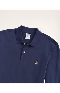 A classic in every way, you just can't go wrong spending your leisure hours in this long-sleeve polo made from a stretch piqué. Spread collar Long sleeves 98% cotton, 2% spandex Machine wash, tumble dry Imported Classic Fitted Navy Polo Shirt, Classic Navy Fitted Polo Shirt, Classic Long Sleeve Solid Polo Shirt, Classic Cotton Polo Shirt For Fall, Classic Long Sleeve Golf Top, Long Sleeve Cotton Polo Shirt For Golf, Fitted Long Sleeve Polo Shirt For Golf, Cotton Long Sleeve Polo Shirt For Golf, Classic Fitted Long Sleeve Polo Shirt