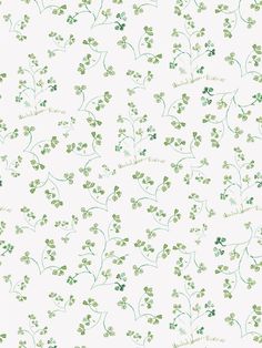 a white wallpaper with green leaves on it