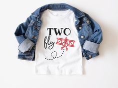 a t - shirt that says two fly with an airplane on the front and back