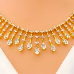 This necklace set, crafted in 18k yellow gold, weighs 29.5 grams and is adorned with diamonds totaling 2.67 carats. These diamonds are of G-H color and VS quality, shaped in the round brilliant cut to enhance their brilliance. The set's length is 18 inches, featuring a sophisticated lobster lock and three inches of adjustable links for a customized fit. It includes matching earrings that are 1.2 inches long with secure screw-back posts. The design is characterized by its graduating marquise drop Bridal Jewelry Necklace, Precious Stones Rings, Diamond Pendant Sets, Modern Bracelets, Mens Gold Rings, Fancy Necklace, 18k Gold Necklace, Fancy Rings, Diamond Necklace Set