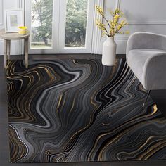 a living room with black and gold marbled flooring in the shape of waves