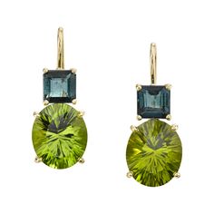 "Granny Smith" apple green and teal-colored gemstones are combined to create these beautiful color-blocked earrings set in 18k yellow gold. The large, custom-cut peridots are extraordinarily brilliant and paired with richly-colored, princess cut indicolite tourmalines, they form such a sophisticated color palette! Designed to make you shine with confidence! Handmade in 18k yellow gold by our Master Jewelers in Los Angeles. Peridots, 12.00 x 10.00mm, 9.57 carat total Indicolite tourmalines, 6.00 Luxury Green Oval Earrings, Luxury Green Multi-stone Earrings, Green Earrings With Gemstone Accents For Formal Events, Formal Green Earrings With Gemstone Accents, Green Gemstone Accents Fine Jewelry Earrings, Green Gemstone Accented Fine Jewelry Earrings, Green Gemstone Accents Earrings In Fine Jewelry, Green Multi-stone Drop Earrings, Green Drop Earrings With Gemstone Accents