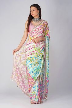 Pink and multi color pre-stitched saree with all over leaf print, attached draped pallu, pleated details, scalloped gota and lace border details. Comes with pink padded blouse with scattered sequin work. - Aza Fashions Saree Blouse Styles, Lehenga Blouse Designs, Fancy Sarees Party Wear, Sari Blouse Designs, Drape Saree, Saree Trends, Latest Sarees, Blouse For Women, Indian Designer Outfits